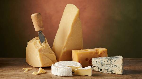 Editorial illustration for Three Biochemical Pathways Explain Why Every Cheese Tastes Different